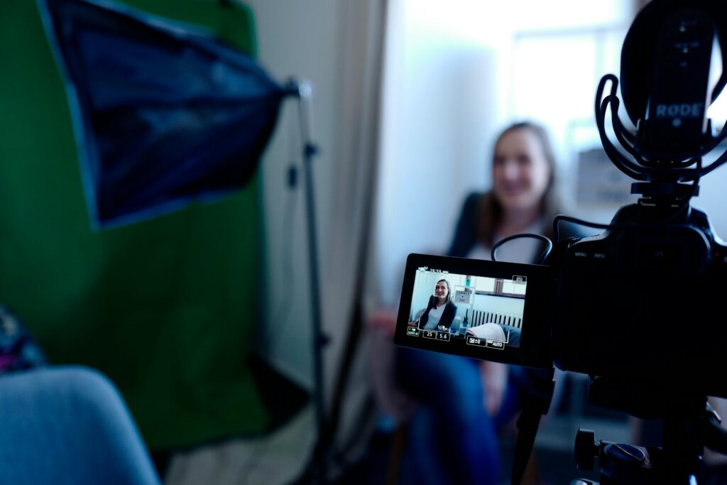 Camera filming a woman